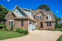Nestled in the sought-after Woodfin Ridge Golf Course community for sale in Inman South Carolina Spartanburg County County on GolfHomes.com