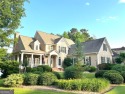 DISCOVER EXCEPTIONAL LAKEFRONT LIVING in the highly sought-after for sale in Newnan Georgia Coweta County County on GolfHomes.com