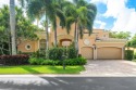 This stunning and meticulously maintained two-story courtyard for sale in Palm Beach Gardens Florida Palm Beach County County on GolfHomes.com