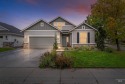 This lovely home is nestled within a serene, gated community for sale in Nampa Idaho Canyon County County on GolfHomes.com