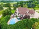 Welcome to your sanctuary at Bristlecone Pines, where luxury for sale in Hartland Wisconsin Waukesha County County on GolfHomes.com