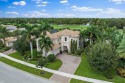 Former Toll Brothers Casa Vicenza model home loaded with extras for sale in Jupiter Florida Palm Beach County County on GolfHomes.com