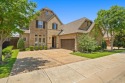 This exquisite East-facing property offers a perfect blend of for sale in The Colony Texas Denton County County on GolfHomes.com