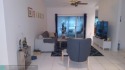 CORNER UNIT WITH A 2/2 AND A 1 CAR GARAGE UNIT OVERLOOKS THE for sale in Weston Florida Broward County County on GolfHomes.com