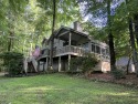 BEAUTIFULLY SITUATED ALONG THE 8th GREEN of the golf course for sale in Lake Toxaway North Carolina Transylvania County County on GolfHomes.com
