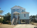 The front is beautifully landscaped with 3-zoned programmable for sale in Nags Head North Carolina Dare County County on GolfHomes.com