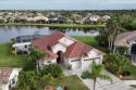 Welcome to your dream lakefront home with a stunning sunset for sale in North Port Florida Sarasota County County on GolfHomes.com