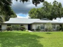 Nestled on a tree-shaded lot on a quiet cul-de-sac street, this for sale in Winter Haven Florida Polk County County on GolfHomes.com