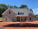 All Brick 5-BEDROOM home in prestigious Lake Dow North Estates for sale in Mcdonough Georgia Henry County County on GolfHomes.com