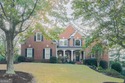 Experience refined living at 1041 Windermere Crossing an elegant for sale in Cumming Georgia Forsyth County County on GolfHomes.com
