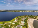 Luxurious Lakefront Oasis,nestled within this prestigious gated for sale in West Palm Beach Florida Palm Beach County County on GolfHomes.com