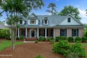 Welcome to 1006 Butler National--a beautifully appointed brick for sale in Wilmington North Carolina New Hanover County County on GolfHomes.com