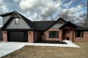 Beautiful new construction in Bella Vista! Near trails and golf for sale in Bella Vista Arkansas Benton County County on GolfHomes.com