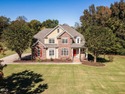 Custom-built home overlooking the 6th tee of Riverwood Golf for sale in Clayton North Carolina Johnston County County on GolfHomes.com