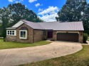 Located in the Village Green subdivision, this spacious move-in for sale in Mountain Home Arkansas Baxter County County on GolfHomes.com