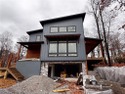 Striking contemporary new build with estimated completion for sale in Bella Vista Arkansas Benton County County on GolfHomes.com