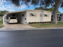 A sanctuary within the serene confines of Palm Hill, a for sale in Largo Florida Pinellas County County on GolfHomes.com