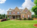 Welcome to your dream home! This stunning 6-bedroom, 5 for sale in Canton Georgia Cherokee County County on GolfHomes.com