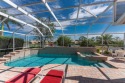 Tired of the chilly winters?  This beautiful 3/2 HEATED POOL for sale in Englewood Florida Charlotte County County on GolfHomes.com