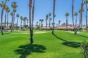 Watch the golfers putt from the extra large tiled patio of this for sale in Palm Desert California Riverside County County on GolfHomes.com
