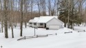 Nestled amidst four-season splendor, this home spans over 3100 for sale in Bellaire Michigan Antrim County County on GolfHomes.com