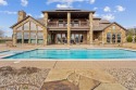 Discover the epitome of luxury living in this stunning 4-bedroom for sale in Weatherford Texas Parker County County on GolfHomes.com