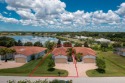 Come relax and unwind in this beautiful Lakefront move-in ready for sale in Port Charlotte Florida Charlotte County County on GolfHomes.com