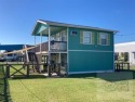 Welcome to this fresh, colorful, adorable beach house. This for sale in Crystal Beach Texas Galveston County County on GolfHomes.com