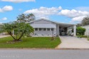 Welcome to this charming 2-bedroom, 2-bathroom manufactured home for sale in Barefoot Bay Florida Brevard County County on GolfHomes.com