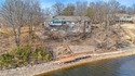 Experience stunning lakefront living on Loch Lomond in this for sale in Bella Vista Arkansas Benton County County on GolfHomes.com