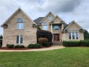 Welcome to this custom-built, all-brick home nestled in the golf for sale in Smithfield Virginia Isle of Wight County County on GolfHomes.com