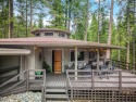 Light, bright, and beautifully updated! This cabin is nestled for sale in Lake Almanor California Plumas County County on GolfHomes.com