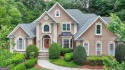 Gorgeous 5 bed/4.5 bath MASTER-ON-MAIN home with HEATED for sale in Suwanee Georgia Gwinnett County County on GolfHomes.com
