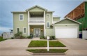 Beach living is at its best in this FULLY FURNISHED custom-built for sale in Corpus Christi Texas Nueces County County on GolfHomes.com