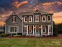 Discover luxury lake living in this like-new, custom-built home for sale in Mooresville North Carolina Iredell County County on GolfHomes.com