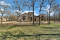 This exquisite modern Spanish-style custom home located in a for sale in Lipan Texas Parker County County on GolfHomes.com