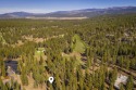 Situated high above the iconic par three 14th hole of the Fazio for sale in Truckee California Nevada County County on GolfHomes.com