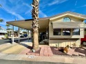 Spacious Corner Lot Home with Rare Fenced Patio & Arizona Room for sale in Apache Junction Arizona Pinal County County on GolfHomes.com