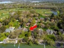 Welcome to your dream home on the shores of private all-sports for sale in West Bloomfield Michigan Oakland County County on GolfHomes.com