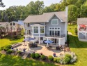 Live the lakefront dream at this exceptional 4-bedroom, 5.5-bath for sale in Malvern Ohio Carroll County County on GolfHomes.com
