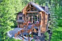 This pristine luxury log cabin, in an idyllic private setting for sale in Victor Idaho Teton County County on GolfHomes.com