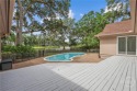 This beautifully updated home in The Landings offers privacy for sale in Savannah Georgia Chatham County County on GolfHomes.com