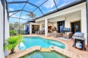 Assumable 2.375% loan!!!   This truly STUNNING Home is Nestled for sale in Marco Island Florida Collier County County on GolfHomes.com