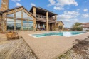 Discover the epitome of luxury living in this stunning 4-bedroom for sale in Weatherford Texas Parker County County on GolfHomes.com