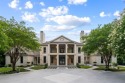Set at the quiet end of an exclusive cul-de-sac, beyond a secure for sale in Atlanta Georgia Fulton County County on GolfHomes.com