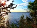This fully wooded lakefront lot w/ 153' of frontage has westerly, Wisconsin