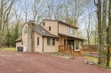 Discover the perfect mountain retreat at this contemporary home for sale in Lake Harmony Pennsylvania Carbon County County on GolfHomes.com