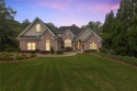 FIRST TIME ON THE MARKET! This exquisite 4-side blush brick for sale in Flowery Branch Georgia Hall County County on GolfHomes.com