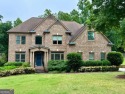 WELCOME HOME! TERRIFIC HOME ON THE CLUBHOUSE SIDE OF WOODMONT for sale in Canton Georgia Cherokee County County on GolfHomes.com