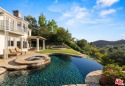 Welcome to a breathtaking retreat nestled within the exclusive for sale in Calabasas California Los Angeles County County on GolfHomes.com